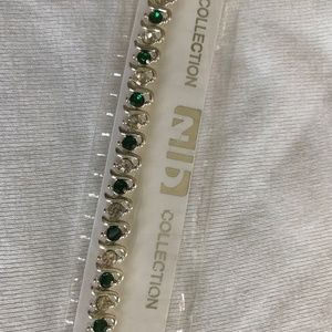 silvertone and emerald tennis bracelet